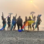 Luxury Chicago bachelorette group champagne toast with city views